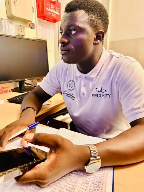 Eagle Elite Security Guard at a desk, ready to assist